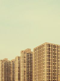 Low angle view of skyscrapers against clear sky