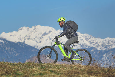 Young man during mountain bike excursion in the hill