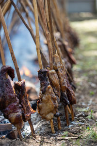 Close-up of meat on barbecue grill