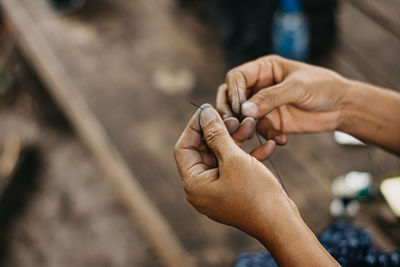 Close-up of man holding cigarette