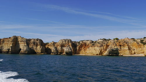 Scenic view to colorful rocky coastline of algarve, portugal seen from the boat