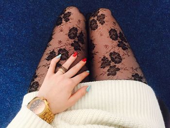 Midsection of woman wearing netting stockings