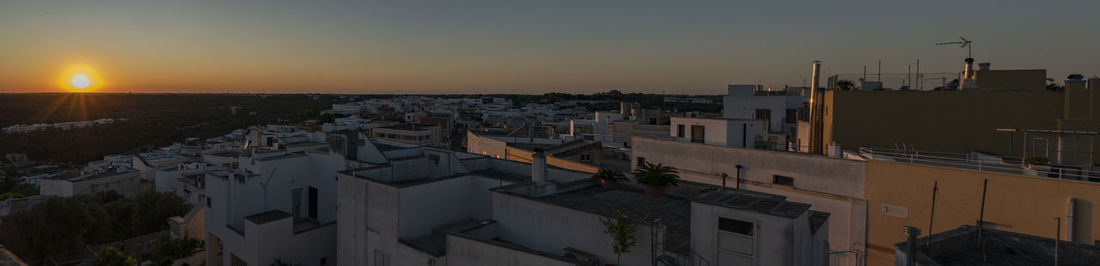 High angle view of townscape against sky during sunset