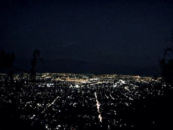 Aerial view of illuminated cityscape