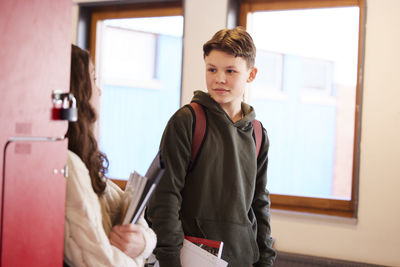 Teenagers talking at corridor