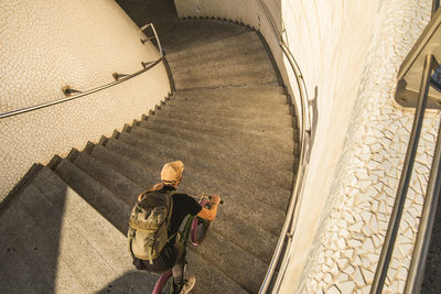 High angle view of man riding bicycle on staircase