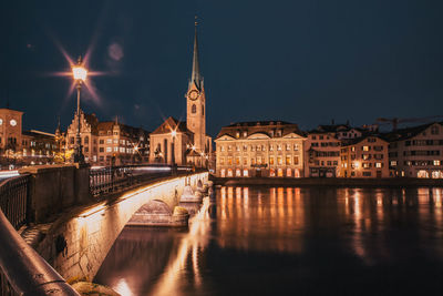 Illuminated buildings in city at night