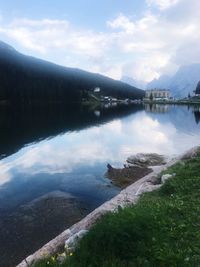 Scenic view of lake and mountains against sky