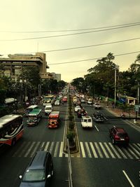 Traffic on road in city against sky