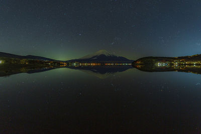 Mt. fuji and the starry sky in lake yamanaka