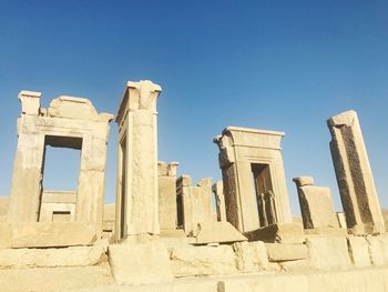 Low angle view of old ruins against clear sky