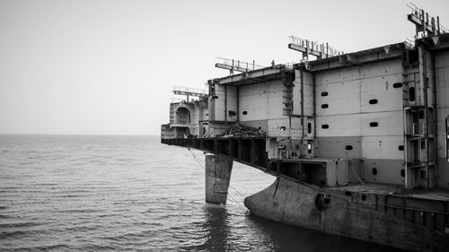 Ship in sea against clear sky