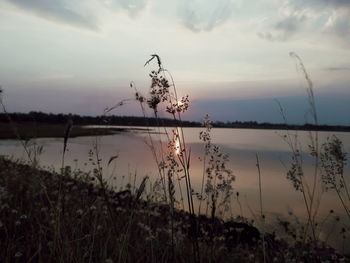 Scenic view of lake against sky during sunset