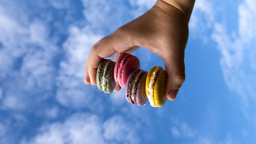 Colourful macaroons on blue sky background