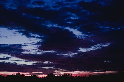 Low angle view of dramatic sky at sunset