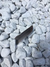 High angle view of stones on pebbles