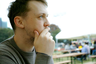 Thoughtful man looking away outdoors