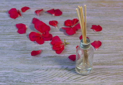 Close-up of red flowers on table