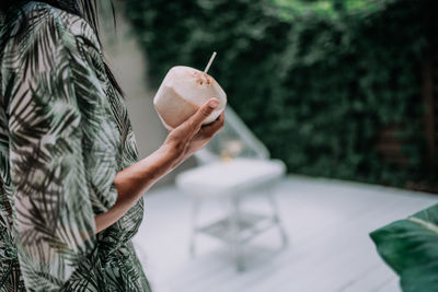 Close-up of hand holding ice cream