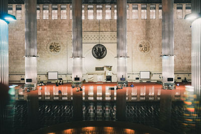 Empty chairs and tables in building