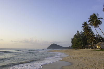 Scenic view of beach against clear sky