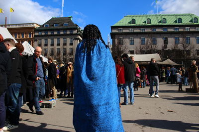 People standing at town square on sunny day