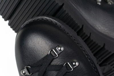 Black hiker boots with silver eyelets and stormwelted closeup