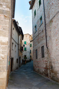 Narrow alley amidst buildings in town