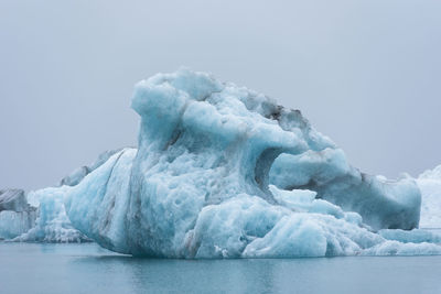 Floating icebergs in jokulsarlon glacial lagoon, iceland. global warming