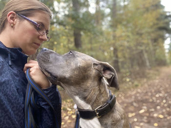 Woman with dog in forest