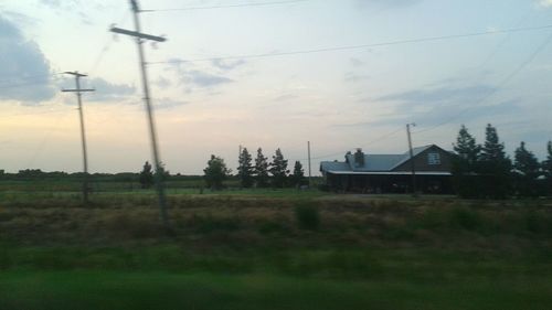 Electricity pylons on field