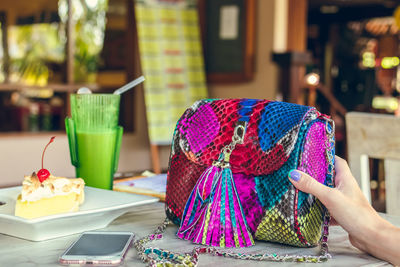 Python skin bag on a table in a restaurant