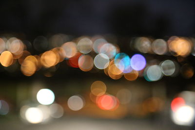 Defocused image of colorful illuminated lights at night