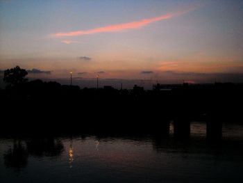 Scenic view of lake at sunset