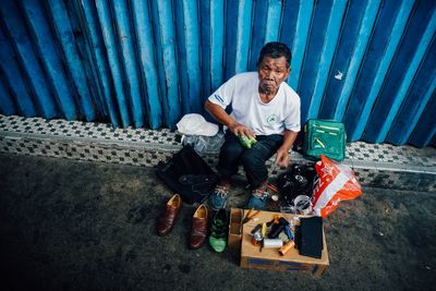 Portrait of a smiling young man sitting at toy