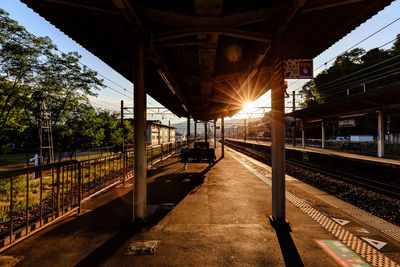 Train at railroad station against sky