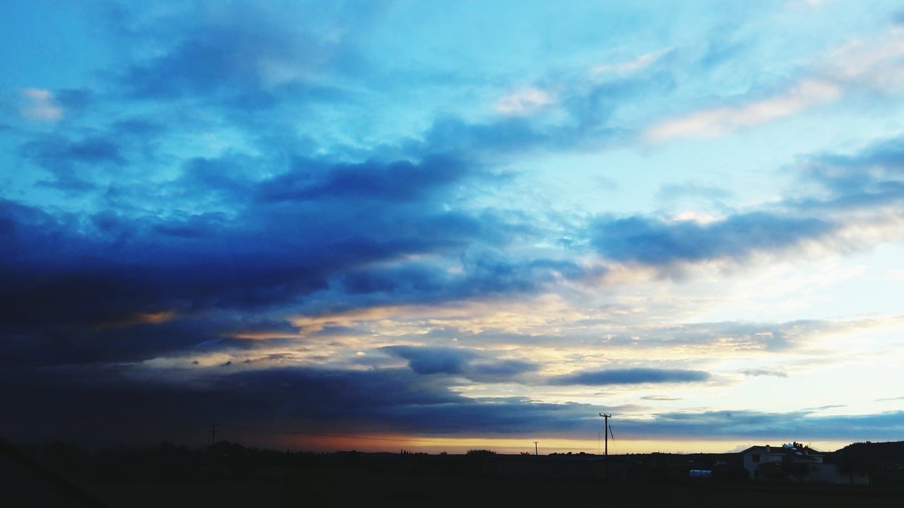 sky, cloud - sky, sunset, silhouette, scenics, beauty in nature, cloudy, tranquility, tranquil scene, cloud, nature, landscape, dramatic sky, dusk, weather, outdoors, cloudscape, idyllic, moody sky, overcast