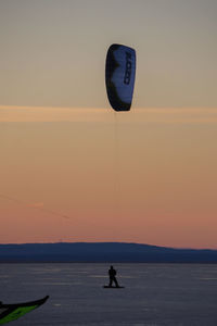 Silhouette of people at sunset