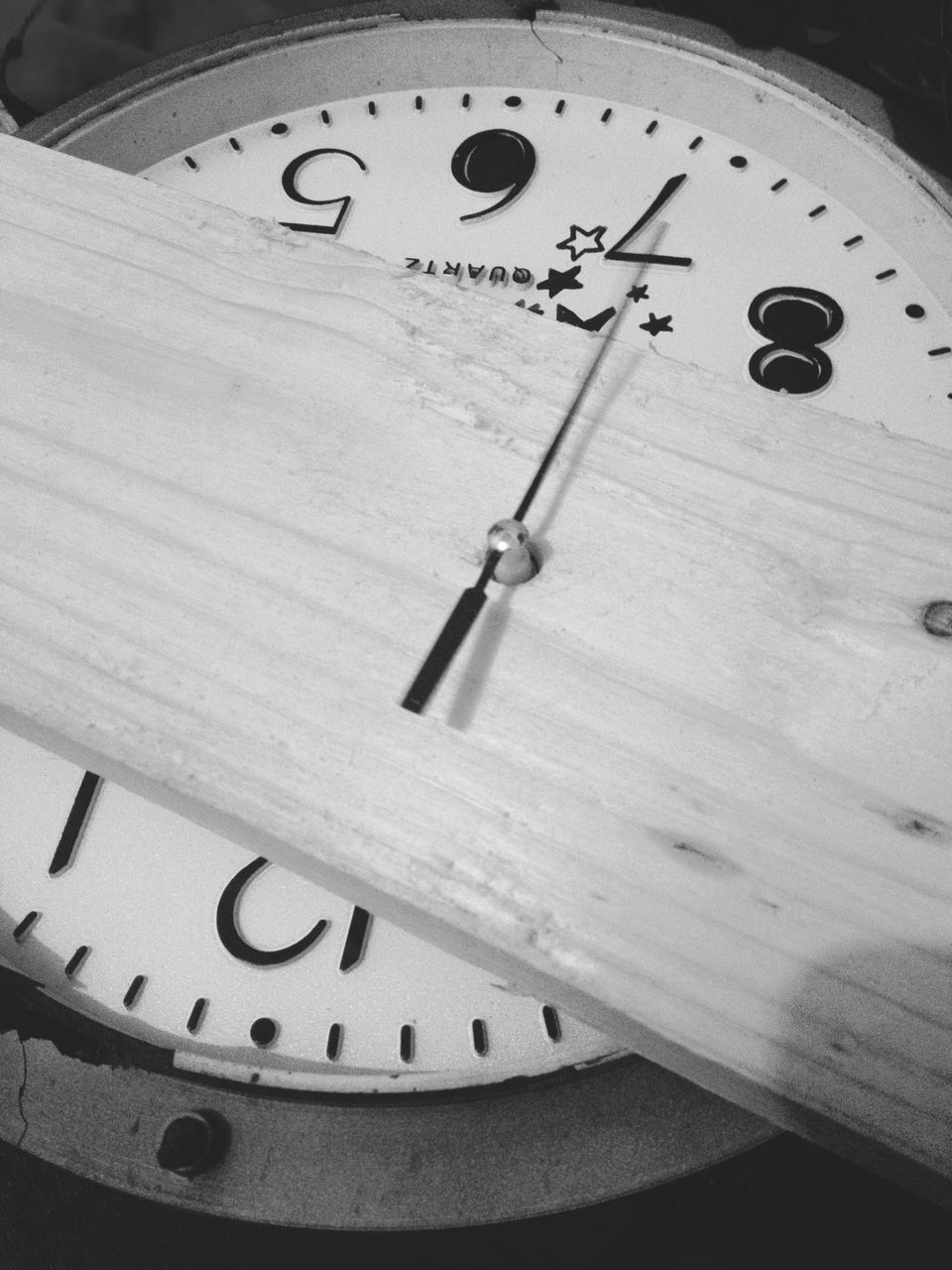 indoors, close-up, number, communication, text, high angle view, technology, still life, accuracy, time, western script, table, equipment, no people, single object, clock, selective focus, metal, part of, paper