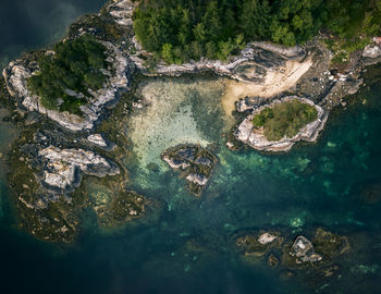 High angle view of rocks in sea