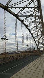 Bridge against sky in city