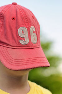 Close-up of boy with cap on face