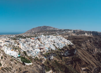 High angle view of townscape against clear blue sky