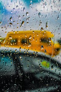 Full frame shot of wet glass window in rainy season