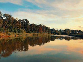 Scenic view of lake against sky during sunset