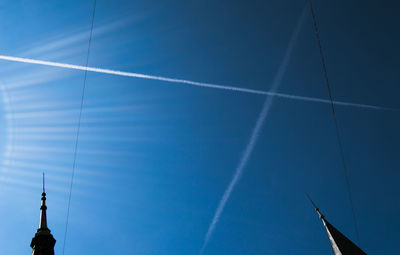 Low angle view of vapor trails in sky