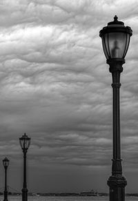 Low angle view of street light against sky