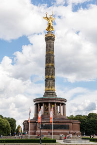 Low angle view of statue against cloudy sky