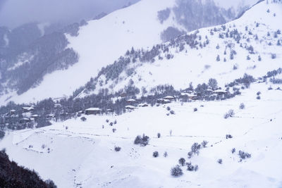 Scenic view of snow covered mountains