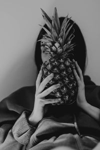 Midsection of woman holding fruit